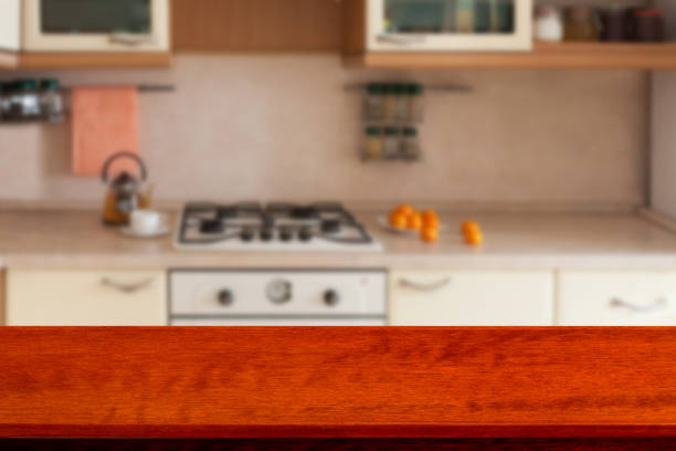 istock Empty wooden table and blurred kitchen background, product montage display. Mock up . 871675738