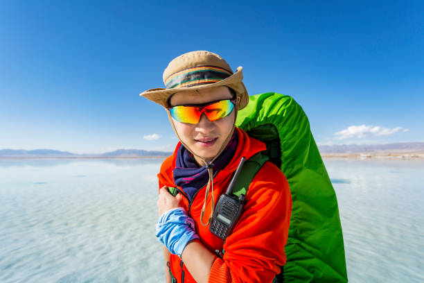 istock Young man standing in the Chaka Salt Lake 871675888