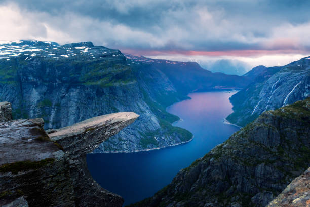 Breathtaking view of Trolltunga rock - most spectacular and famous scenic cliff in Norway
