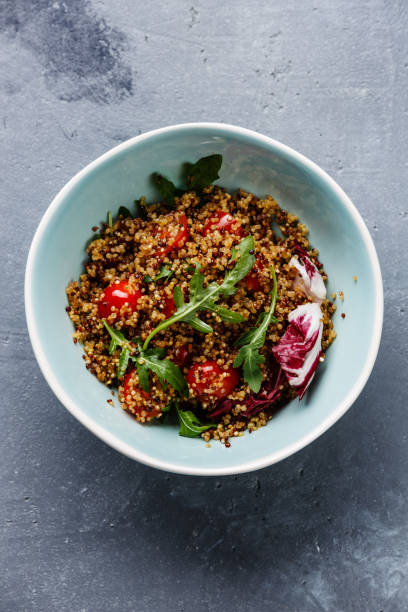 istock Salad with quinoa, tomato and arugula 871679396