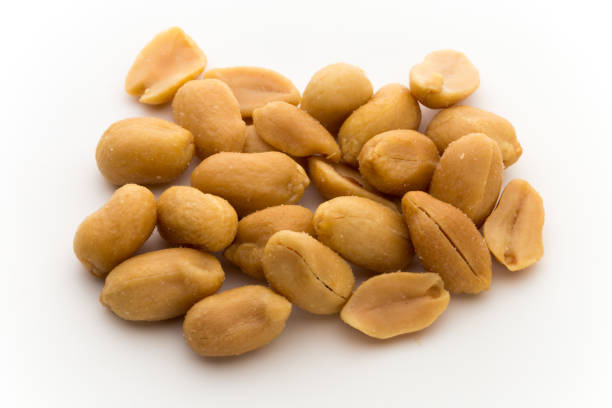 istock Peeled peanuts on the isolated background. 871679818