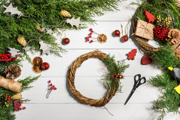 istock How to make christmas door wreath. The working process. The decorator's workplace. Top view 871682820