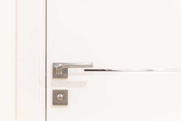 istock Metalic doorknob on a white modern door 871687206