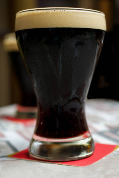 istock Two glasses of dark beer 871692504