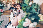 Enjoying a good book outdoors in the garden