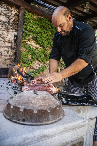 istock Cook Preparing Traditional Mediterranean Meal Peka 871695394
