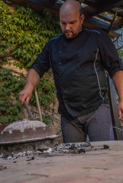 istock Cook Preparing Traditional Mediterranean Meal Peka 871695406