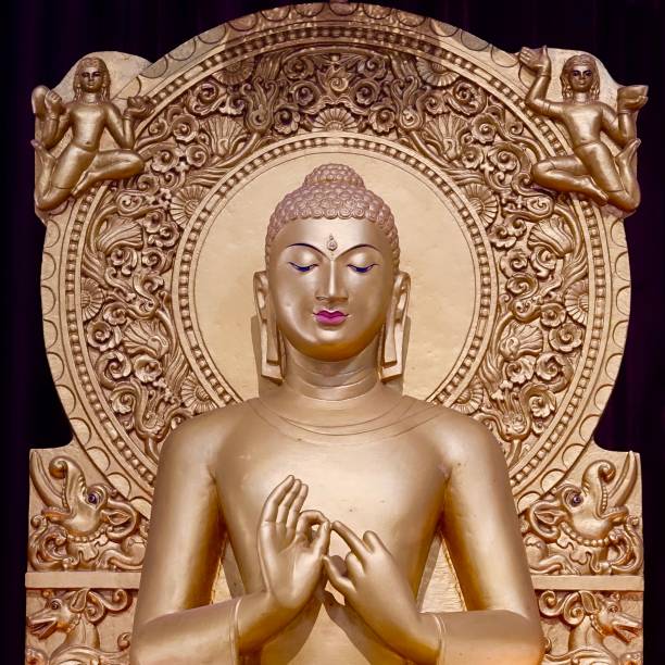 Golden Buddha statue, sitting in a small Buddhism temple close to Connaught Place in Delhi, India sarnath stock pictures, royalty-free photos & images