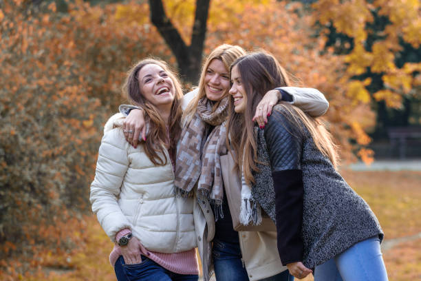 istock Three beautiful girls in park 871697204