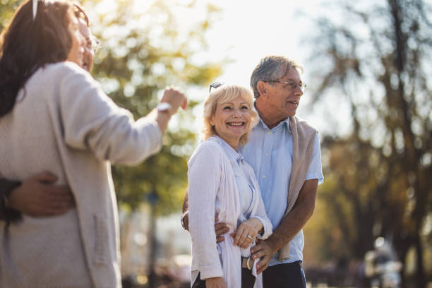 istock Mature Couple Embracing, Walking Around 871703082