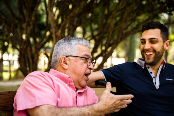 istock Dad and son having fun in the park 871704256