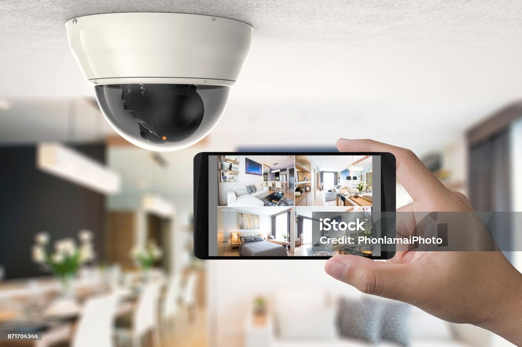 mobile connect with security camera hand holding 3d rendering mobile connect with security camera Security Camera Stock Photo