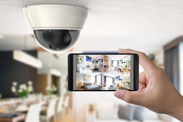 mobile connect with security camera hand holding 3d rendering mobile connect with security camera security system stock pictures, royalty-free photos & images