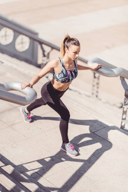 istock fitness woman stretching the legs 871706420