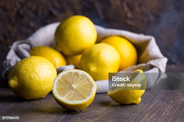 Group Of Fresh Lemon On An Old Vintage Wooden Table Stock Photo - Download Image Now