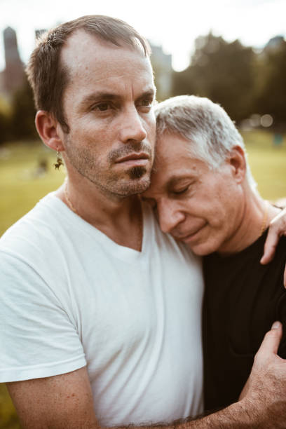 istock gay couple embracing in central park 871707682