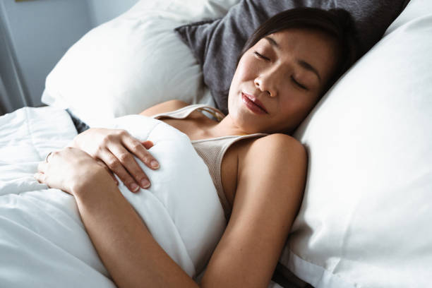 istock chinese woman sleeping on the bed 871707958