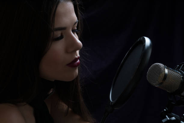 istock Beautiful girl In Recording Studio with microphone 871710442