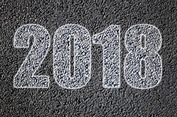 istock 2018 written on asphalt road in white 871710488