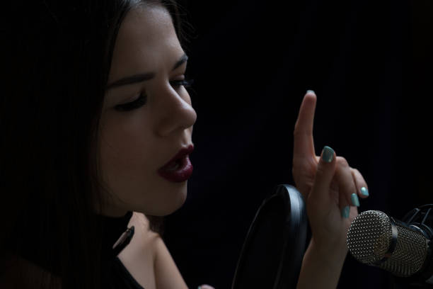 istock Beautiful girl In Recording Studio with microphone 871710694