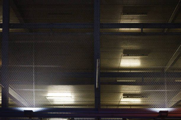 istock Illuminated parking garage in the night 871711964