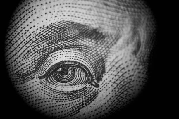 Spying money. Macro of one hundred dollars capitalism stock pictures, royalty-free photos & images