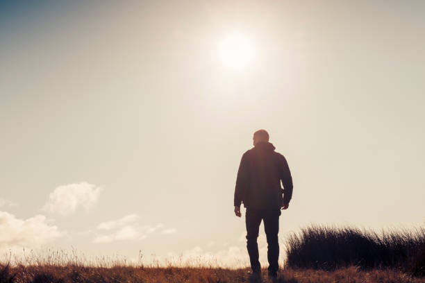istock Man hiking in Autumn sunshine. 871718130