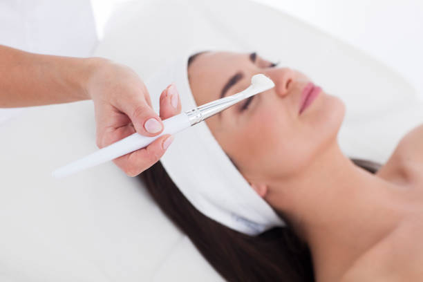 istock Woman with mask on her face resting in spa 871718158