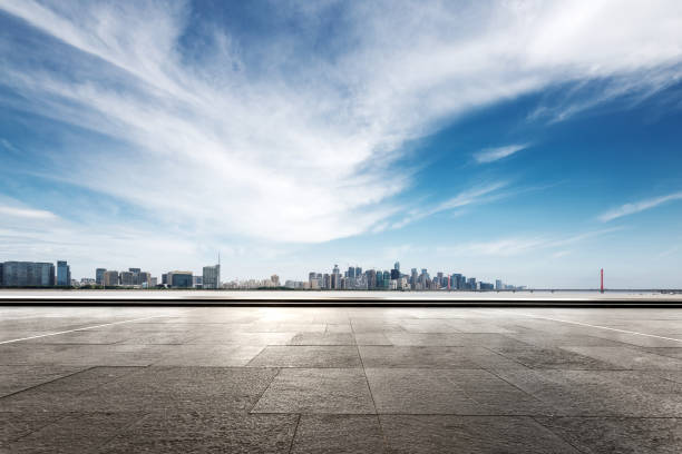 istock empty marble floor with modern bridge and buildings 871718324