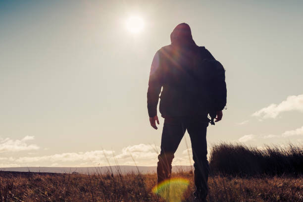 istock Man hiking in Autumn sunshine. 871718340
