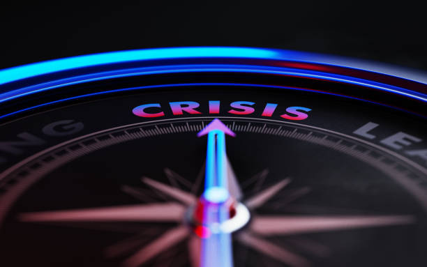 istock Crisis Concept: Arrow of A Compass Pointing Crisis Text 871718674