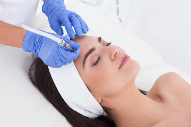 Microdermobrasion.Skin care. Beautiful woman having a beauty treatment in spa. microdermabrasion stock pictures, royalty-free photos & images