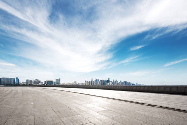 istock empty marble floor with modern bridge and buildings 871719636