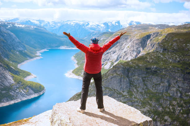 istock Sporty woman posing on Trolltunga Norway 871719640