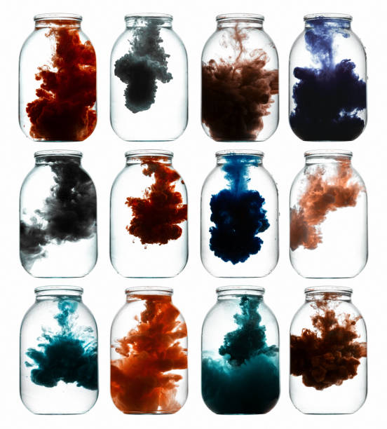 istock Luminous paint swirling in water. 871719790