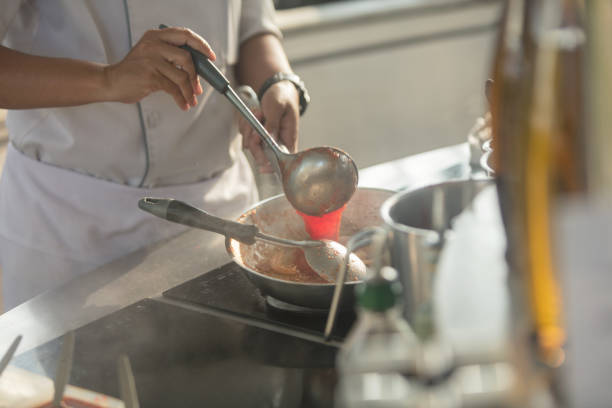 istock Pouring tomato sauce for pasta 871720066