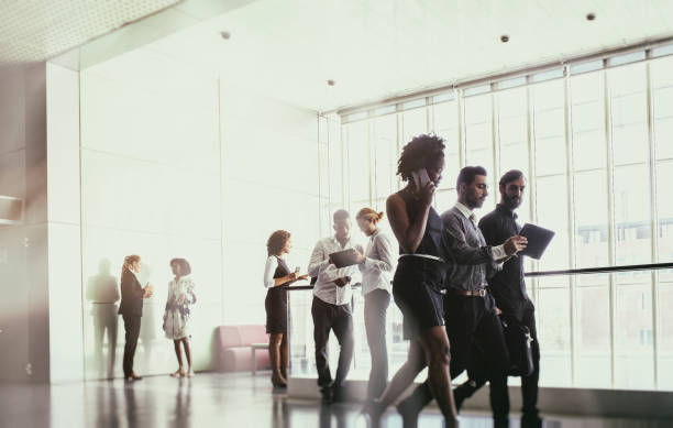 istock Business people walking on the office building lobby 871733872