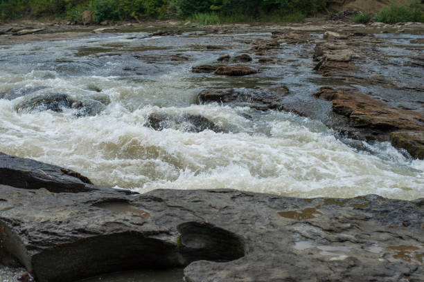 istock Shallow stone rapids of a mountain river 871734470