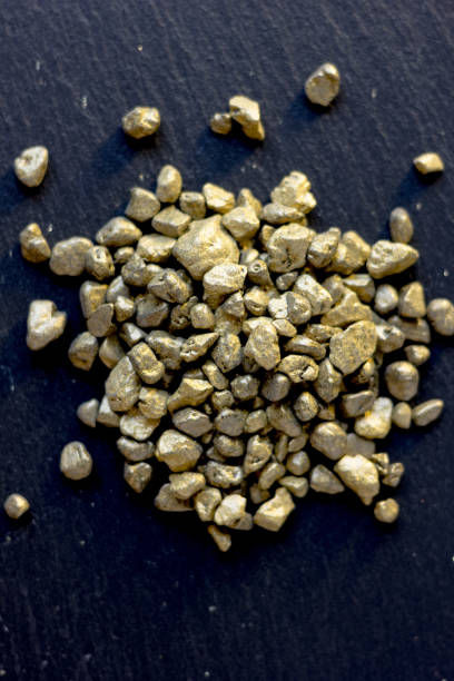 istock Top view of golden sand at black board. 871737148