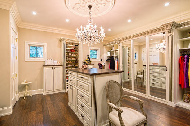 Beautiful custom closet in an estate home Beautiful custom closet in an estate home chandelier photos stock pictures, royalty-free photos & images
