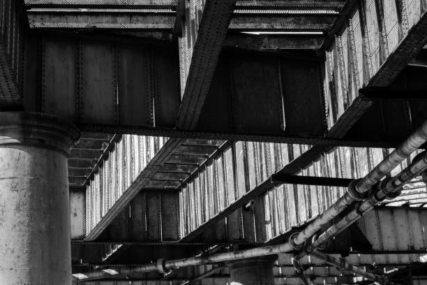 istock Metal beams and concrete columns of river pier underside 871740534