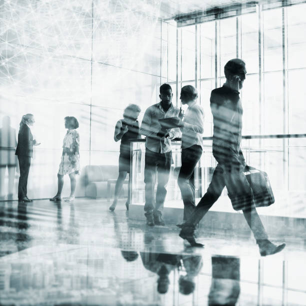 istock Business people walking on the office building lobby 871740634