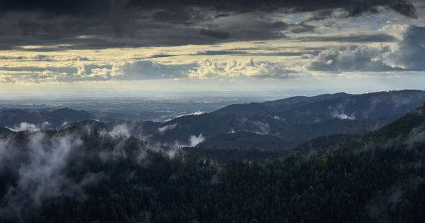 istock Dramatic sky at rainy day in Black Forest in Germany 871740998