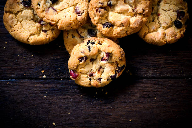istock Sweet cookies on wooden background 871741026