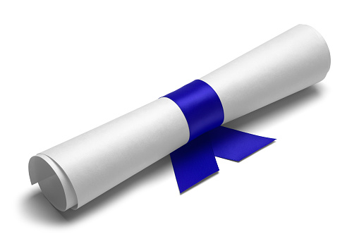 Diploma tied with blue ribbon on a white isolated background.