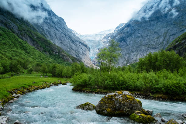 istock View of Briksdalsbreen Glacier and mountain stream 871752430