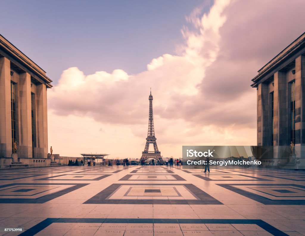 Eiffel tower, Paris symbol and iconic landmark in France, on a cloudy day. Famous touristic places and romantic travel destinations in Europe. Cityscape and tourism concept. Long exposure. Toned Eiffel tower, Paris symbol and iconic landmark in France, on a cloudy day. Famous touristic places and romantic travel destinations in Europe. Cityscape and tourism concept. Long exposure. Toned. Paris - France Stock Photo