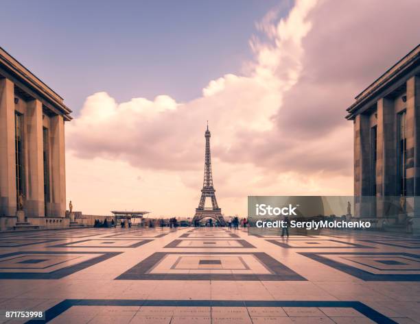 Eiffel Tower Paris Symbol And Iconic Landmark In France On A Cloudy Day Famous Touristic Places And Romantic Travel Destinations In Europe Cityscape And Tourism Concept Long Exposure Toned Stock Photo - Download Image Now