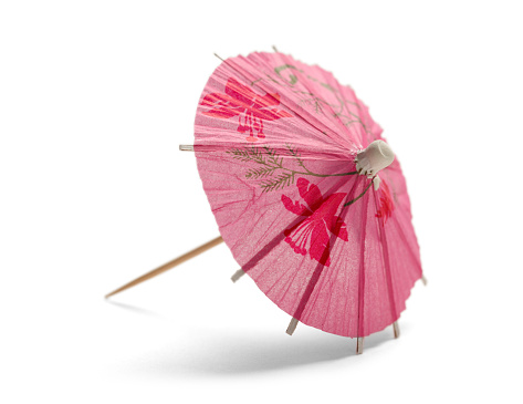 Pink Cocktail Umbrella Isolated on White Background.