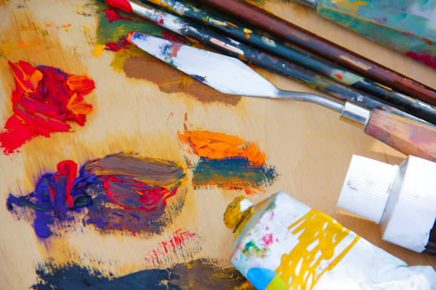 istock oil paint brush on a wooden board 871757658